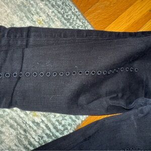 Size 27 super skinny black JBrand jeans w small holes going down back. mid rise